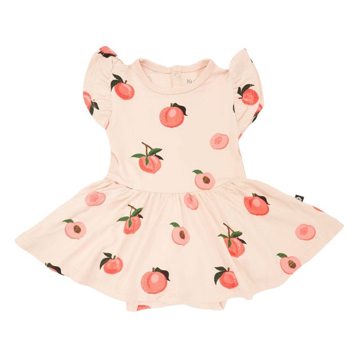 Kyte Baby Twirl Bodysuit Dress in Peach - Princess and the Pea Boutique