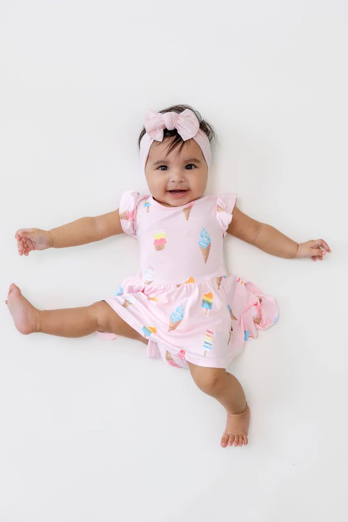 Kyte Baby Twirl Bodysuit Dress in Sakura Ice Cream - Princess and the Pea Boutique