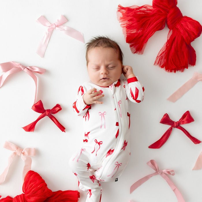 Kyte Baby Zippered Footie in Small Love Bow - Princess and the Pea Boutique