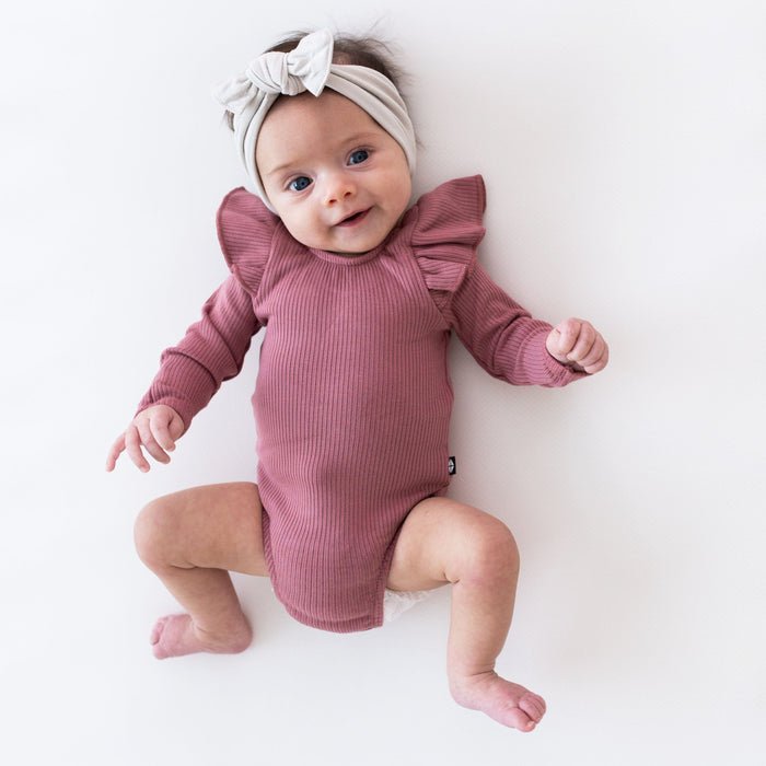 Kyte Baby Ribbed Long Sleeve Ruffle Leotard in Dusty Rose - Princess and the Pea