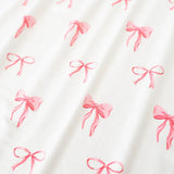 Kyte Baby Twirl Bodysuit Dress in Bow - Princess and the Pea Boutique