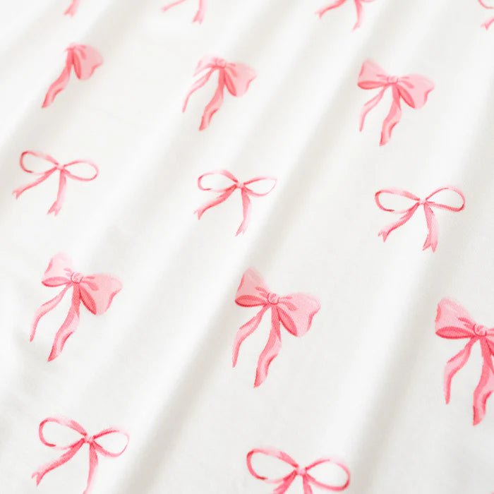 Kyte Baby Twirl Bodysuit Dress in Bow - Princess and the Pea Boutique