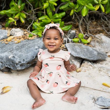 Kyte Baby Twirl Bodysuit Dress in Peach - Princess and the Pea Boutique