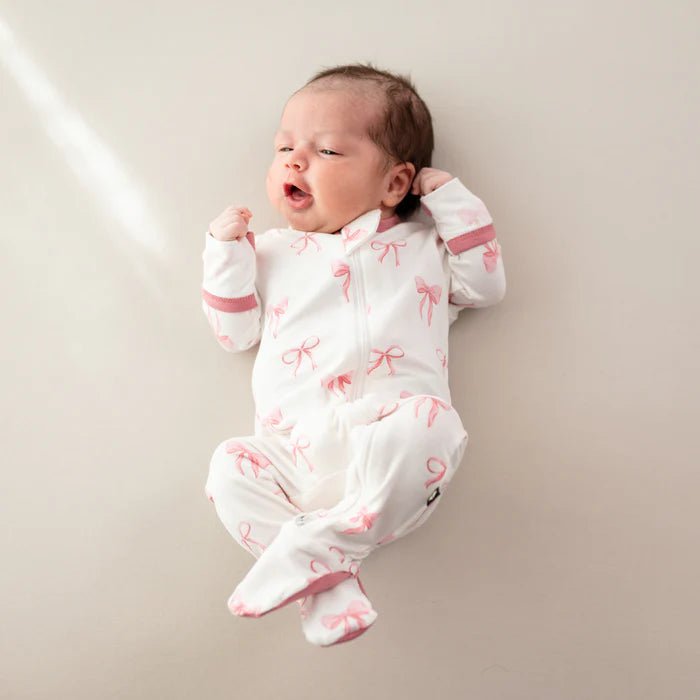 Kyte Baby Zippered Footie in Bow - Princess and the Pea Boutique