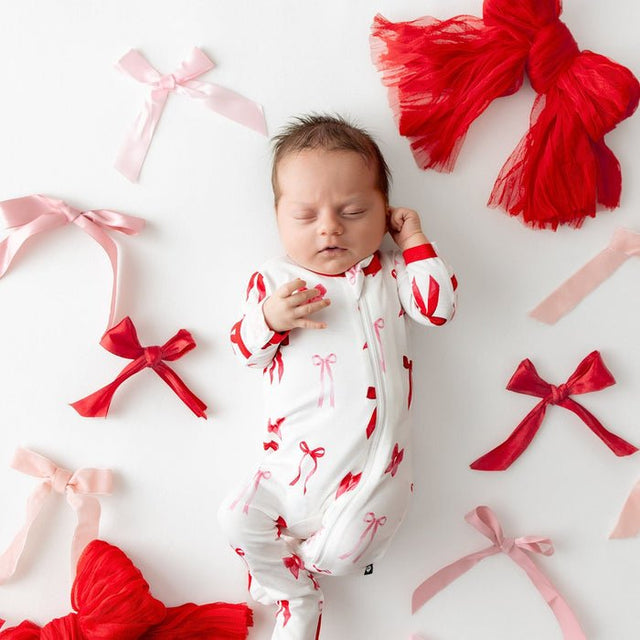 Kyte Baby Zippered Footie in Small Love Bow - Princess and the Pea Boutique