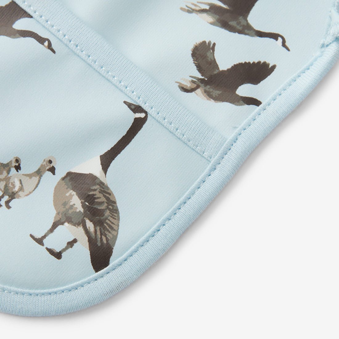 Milkbarn Goose Ruffle Pocket Bib - Princess and the Pea Boutique