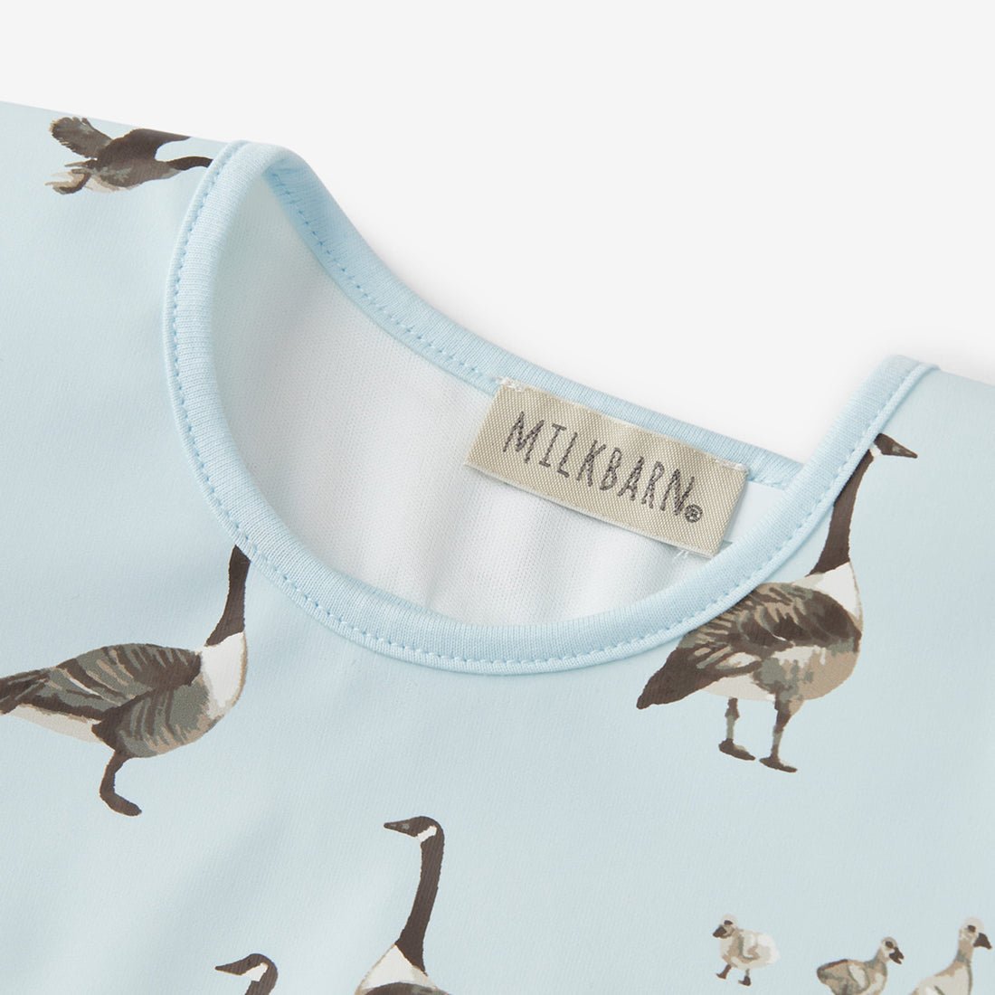Milkbarn Goose Ruffle Pocket Bib - Princess and the Pea Boutique