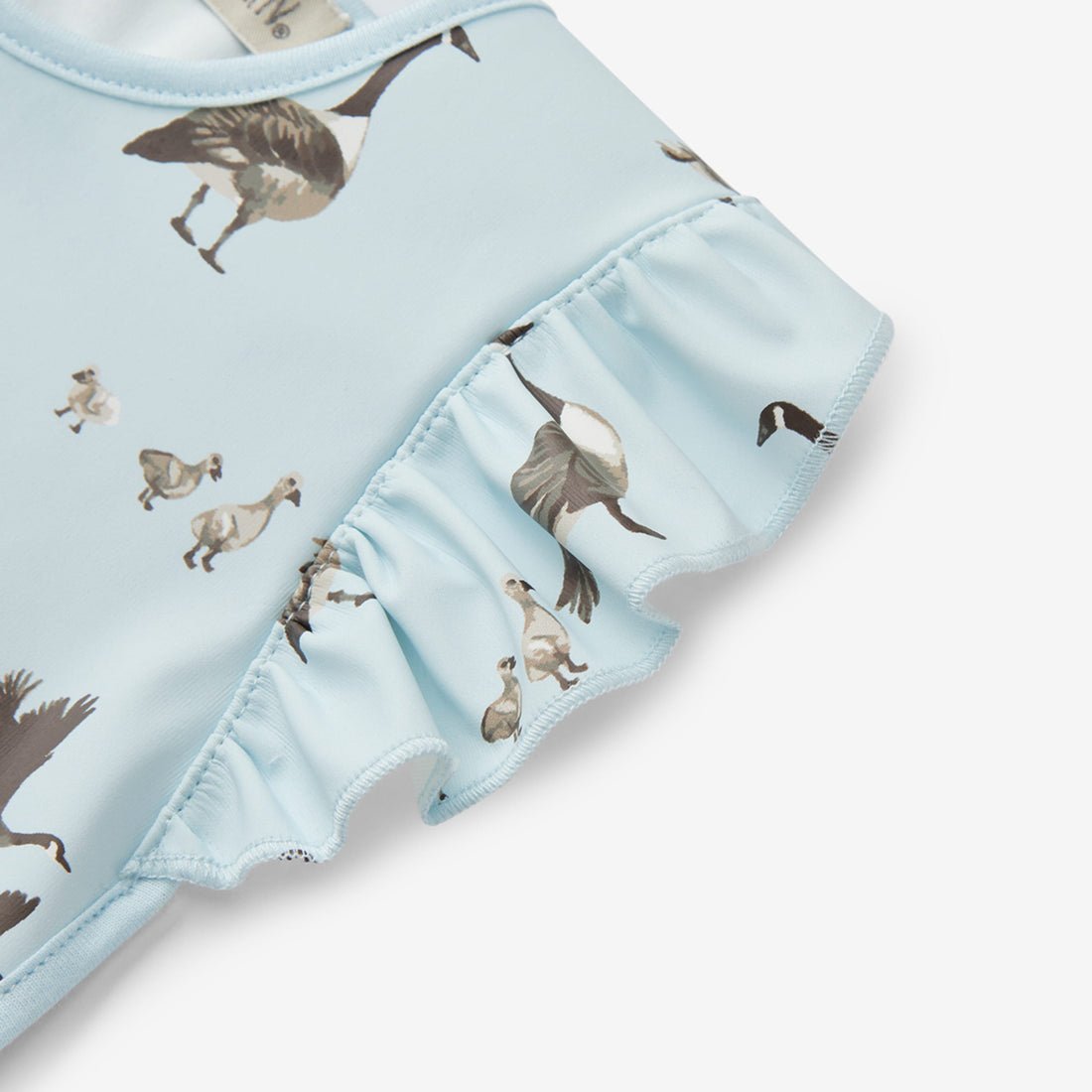 Milkbarn Goose Ruffle Pocket Bib - Princess and the Pea Boutique