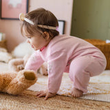 Pink knit one - piece with patterns - Princess and the Pea Boutique